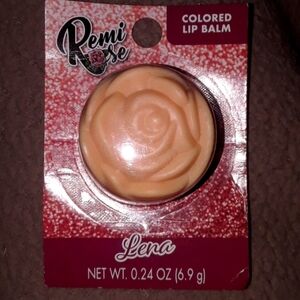 Remi lip balm.  New in packet.